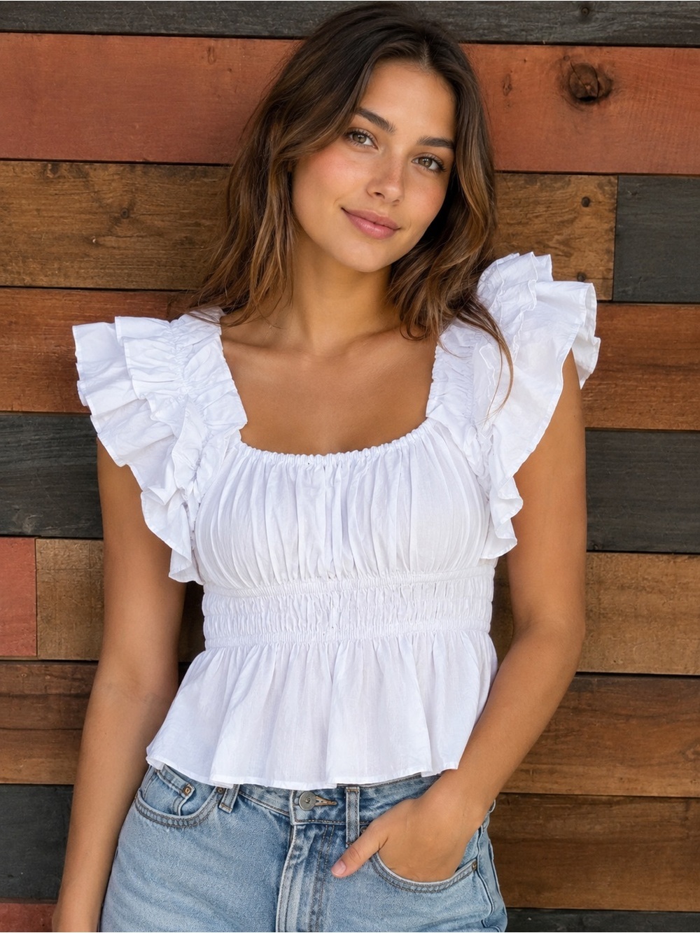 Few Moda peplum is done with a comfy elastic waist and fun ruffled sleeves